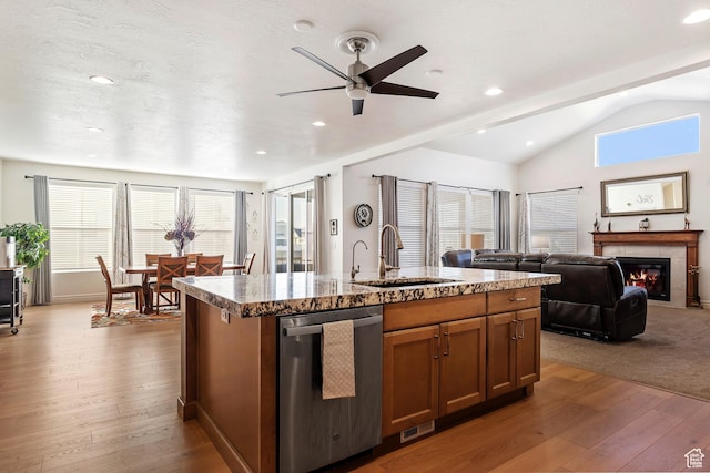 1251 N 2525 W, Clinton, UT 84015 - kitchen featuring stainless steel dishwasher, a glass covered fireplace, wood-type flooring, a ceiling fan, and a sink