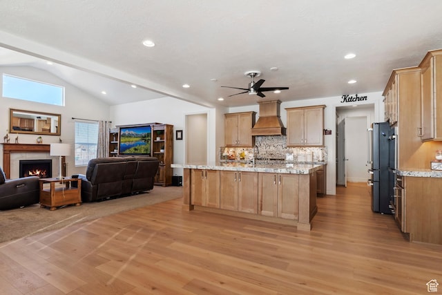 1251 N 2525 W, Clinton, UT 84015 - kitchen featuring light stone countertops, open floor plan, custom range hood, light wood-style flooring, and freestanding refrigerator