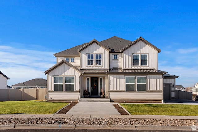 1251 N 2525 W, Clinton, UT 84015 - modern farmhouse featuring a front lawn, a standing seam roof, fence, board and batten siding, and a shingled roof