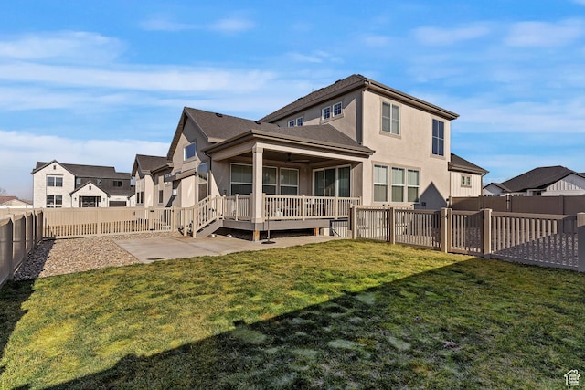1251 N 2525 W, Clinton, UT 84015 - rear view of house featuring a fenced backyard, a residential view, stucco siding, a patio area, and a lawn