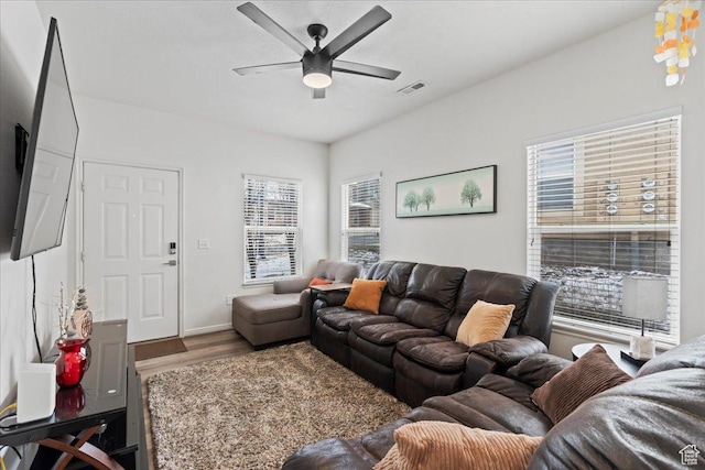 14488 S Stone Stream St W, Herriman, UT 84096 - living room with wood finished floors, a ceiling fan, and visible vents