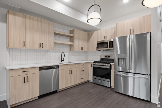 3884 N 4975 E Unit B207, Eden, UT 84310 - kitchen featuring light countertops, appliances with stainless steel finishes, light brown cabinets, and a sink
