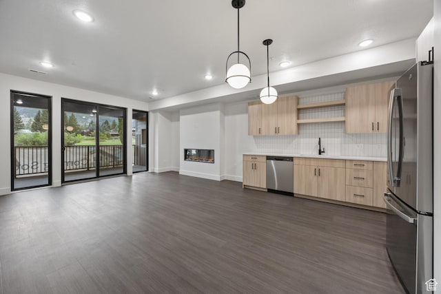3884 N 4975 E Unit B207, Eden, UT 84310 - kitchen with light brown cabinetry, stainless steel appliances, light countertops, open shelves, and a sink