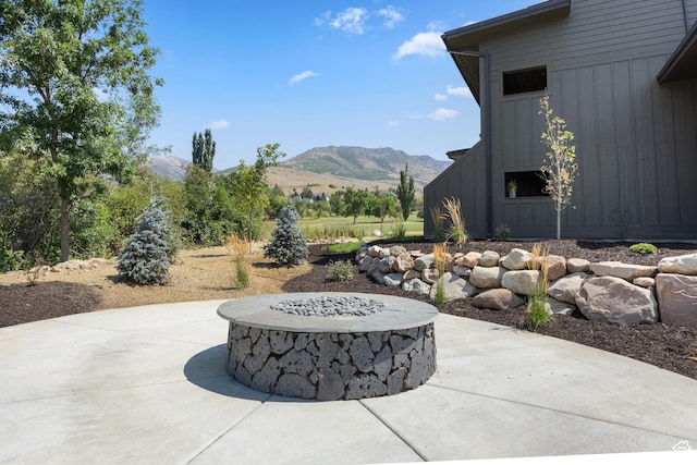 3884 N 4975 E Unit B207, Eden, UT 84310 - view of patio / terrace featuring a fire pit and a mountain view