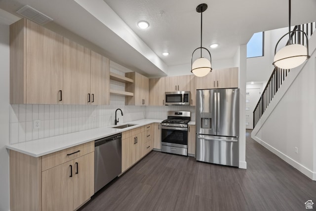 3884 N 4975 E Unit B207, Eden, UT 84310 - kitchen featuring dark wood finished floors, light brown cabinets, stainless steel appliances, and a sink