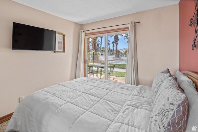 1845 W Canyon Dr S Unit 1610, St George, UT 84770 - bedroom with a textured ceiling and access to exterior
