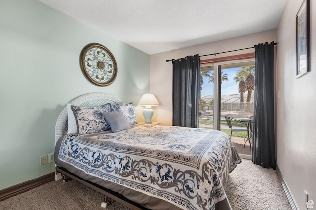1845 W Canyon Dr S Unit 1610, St George, UT 84770 - carpeted bedroom featuring multiple windows, a textured ceiling, baseboards, and access to outside