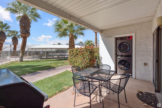 1845 W Canyon Dr S Unit 1610, St George, UT 84770 - view of patio with outdoor dining area, stacked washer and dryer, and fence