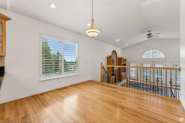 710 E Ridge Crest Ct S, Alpine, UT 84004 - spare room featuring visible vents, ceiling fan, baseboards, lofted ceiling, and wood finished floors