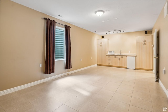 710 E Ridge Crest Ct S, Alpine, UT 84004 - unfurnished room featuring rail lighting, light tile patterned flooring, baseboards, and visible vents