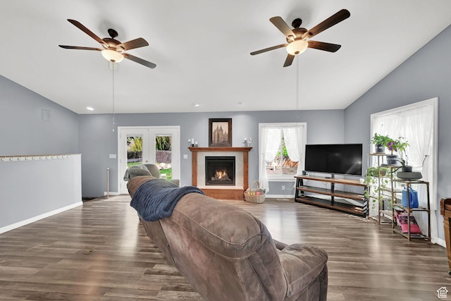 1461 E Antelope Dr, Layton, UT 84040 - living area featuring lofted ceiling, a ceiling fan, wood finished floors, and a lit fireplace