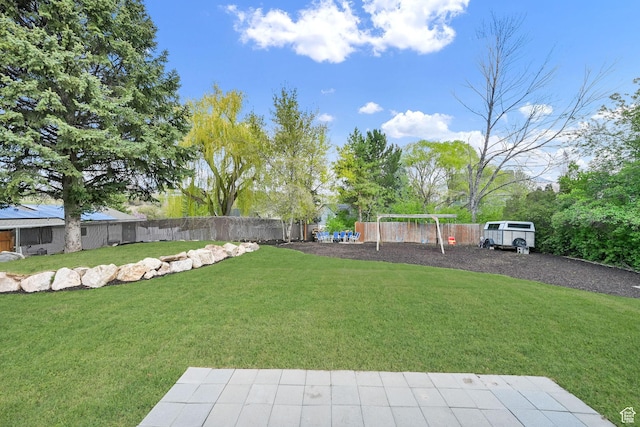 1461 E Antelope Dr, Layton, UT 84040 - view of yard featuring a fenced backyard and a playground