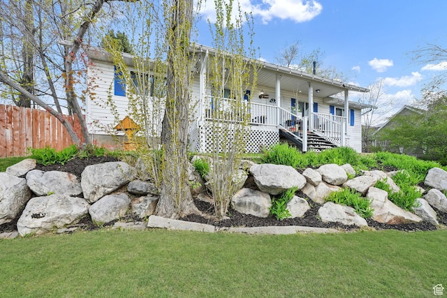1461 E Antelope Dr, Layton, UT 84040 - view of front of property featuring fence, a front yard, and covered porch
