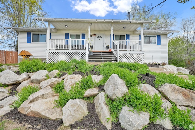 1461 E Antelope Dr, Layton, UT 84040 - view of front of property with a porch, fence, and stairway