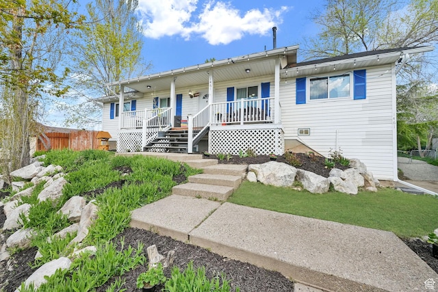 1461 E Antelope Dr, Layton, UT 84040 - view of front of property featuring fence, stairway, and covered porch