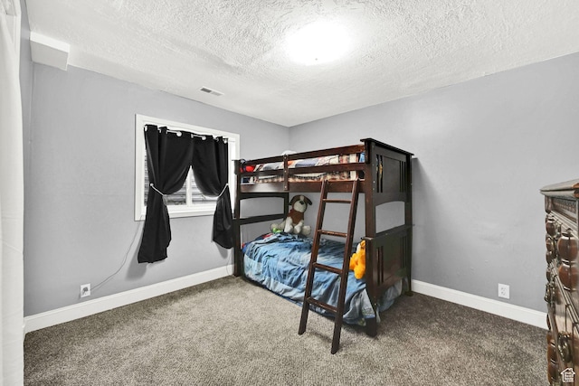 1461 E Antelope Dr, Layton, UT 84040 - bedroom with visible vents, carpet, baseboards, and a textured ceiling