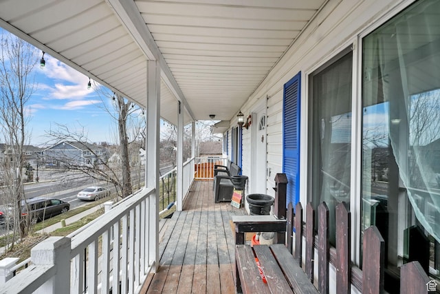 1461 E Antelope Dr, Layton, UT 84040 - wooden deck featuring a porch