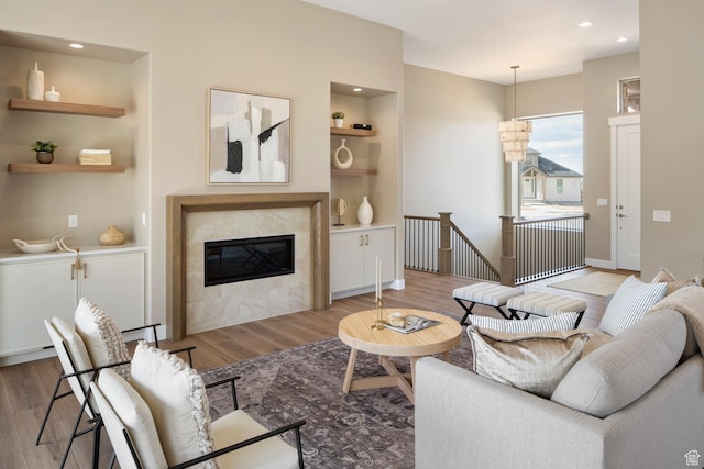 882 E 740 S, Salem, UT 84653 - living area with wood finished floors, built in features, recessed lighting, a fireplace, and baseboards