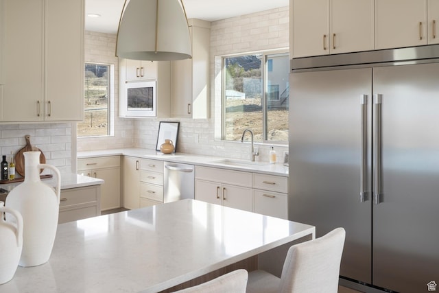 882 E 740 S, Salem, UT 84653 - kitchen with stainless steel appliances, a sink, plenty of natural light, and tasteful backsplash