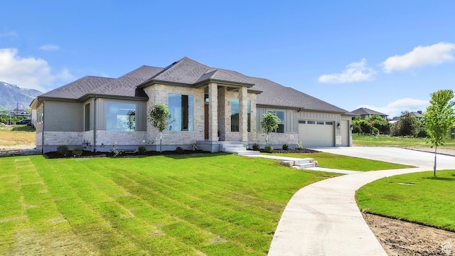 882 E 740 S, Salem, UT 84653 - view of front of home featuring stone siding, a front yard, an attached garage, driveway, and a shingled roof
