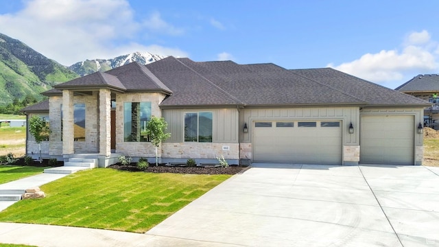 882 E 740 S, Salem, UT 84653 - view of front facade featuring stone siding, a garage, a front yard, driveway, and a mountain view