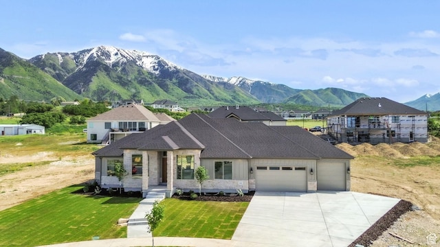 882 E 740 S, Salem, UT 84653 - french country inspired facade with an attached garage, a mountain view, driveway, a front yard, and a shingled roof