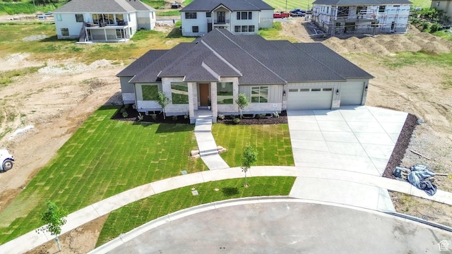 882 E 740 S, Salem, UT 84653 - view of front of property featuring a garage, driveway, a shingled roof, and a front lawn