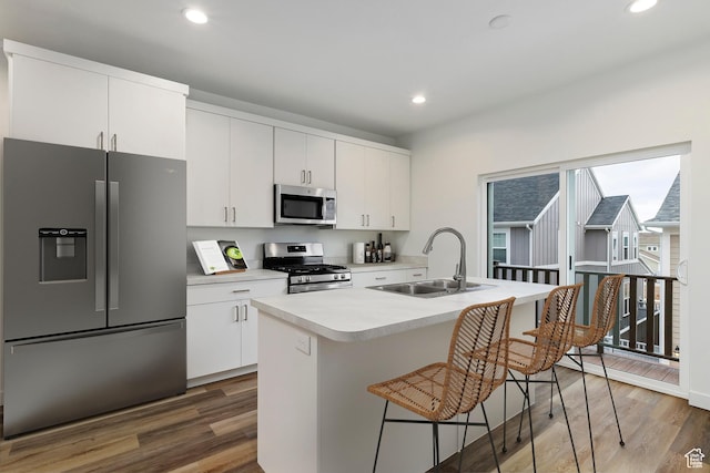 7007 W S Jordan Pkwy Unit 374, South Jordan, UT 84009 - kitchen with appliances with stainless steel finishes, a sink, wood finished floors, light countertops, and recessed lighting
