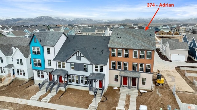 7007 W S Jordan Pkwy Unit 374, South Jordan, UT 84009 - view of front facade with a residential view, a mountain view, and a shingled roof