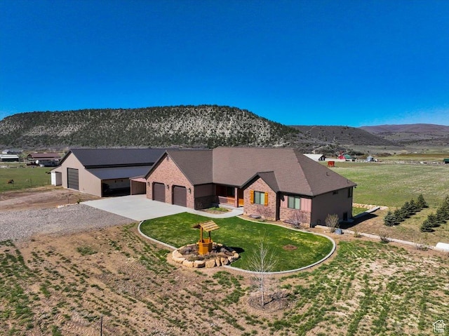 29125 N 11090 E, Fairview, UT 84629 - single story home featuring concrete driveway, an attached garage, a front lawn, and a mountain view