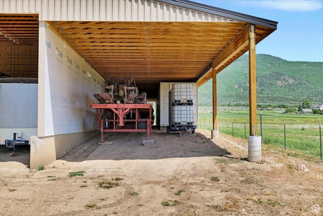 29125 N 11090 E, Fairview, UT 84629 - view of patio with a mountain view, an exterior structure, an attached carport, an outdoor structure, and a rural view