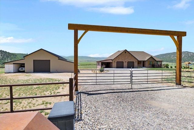 29125 N 11090 E, Fairview, UT 84629 - view of yard with an outdoor structure, dirt driveway, an exterior structure, a mountain view, and a garage