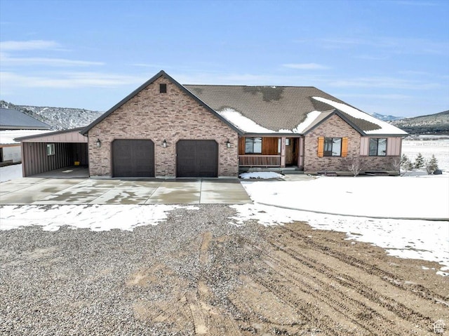 view of front of property featuring concrete driveway, brick siding, and a garage