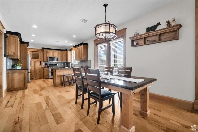 29125 N 11090 E, Fairview, UT 84629 - dining space featuring light wood finished floors, a chandelier, and recessed lighting