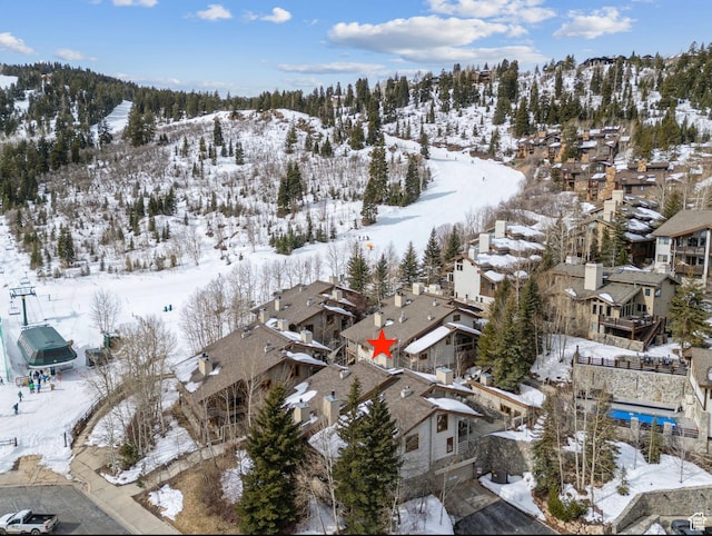 snowy aerial view featuring a residential view