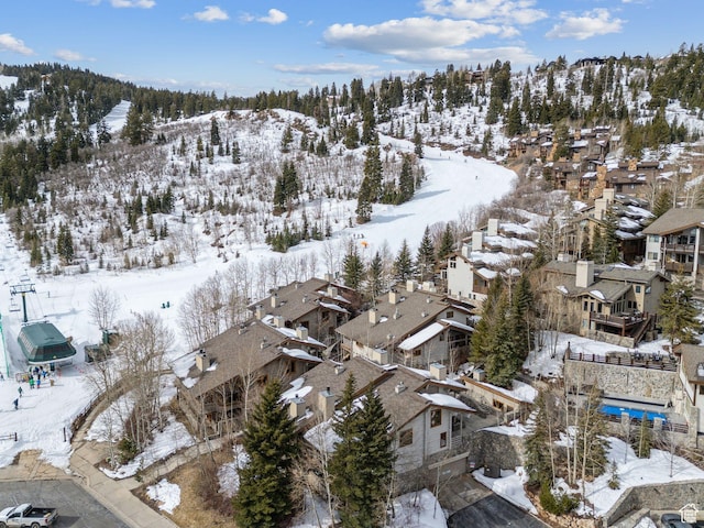 snowy aerial view with a residential view