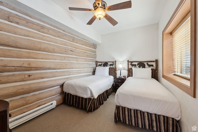 carpeted bedroom with rustic walls, a baseboard heating unit, and ceiling fan