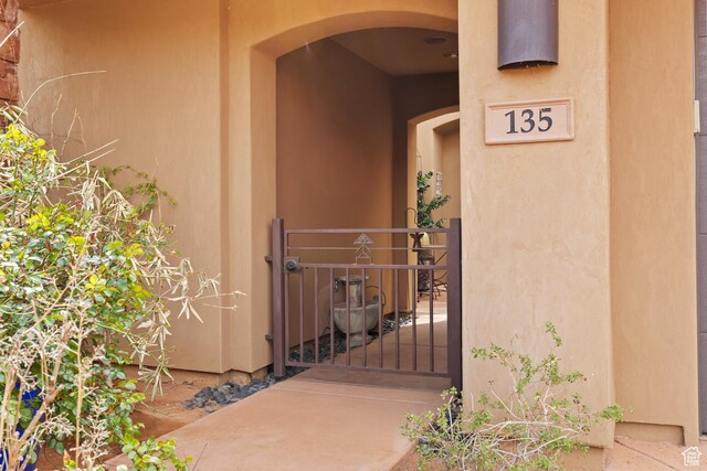 2139 W Cougar Rock Cir S Unit 135, St George, UT 84770 - property entrance featuring a gate and stucco siding