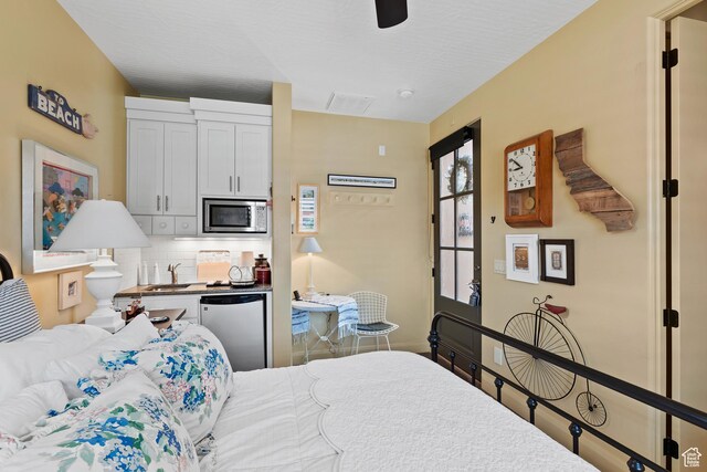 2139 W Cougar Rock Cir S Unit 135, St George, UT 84770 - bedroom featuring a ceiling fan and a sink