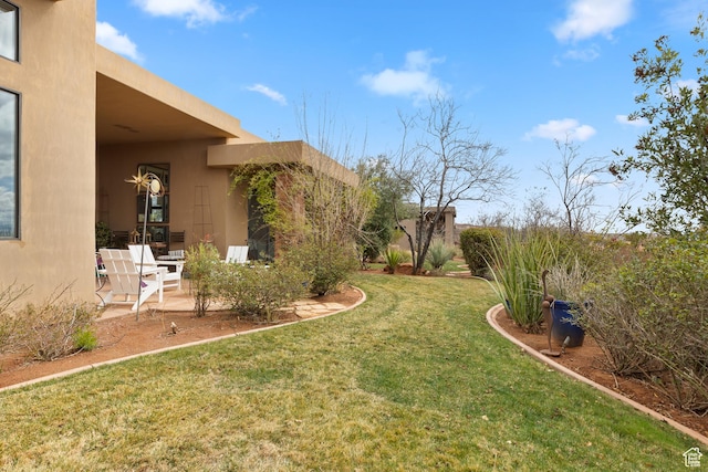 2139 W Cougar Rock Cir S Unit 135, St George, UT 84770 - view of green lawn with a patio area
