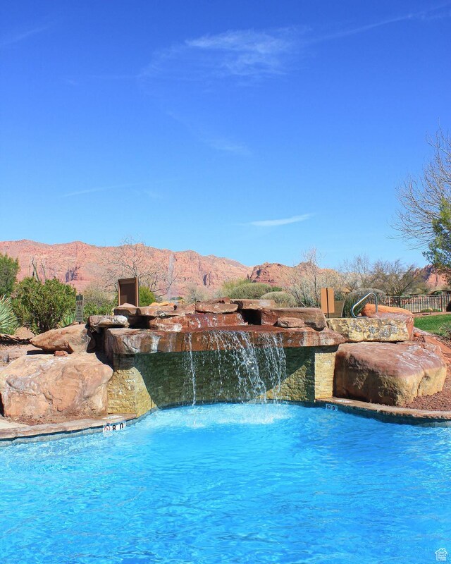 2139 W Cougar Rock Cir S Unit 135, St George, UT 84770 - community pool featuring a mountain view