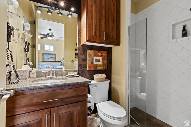 2139 W Cougar Rock Cir S Unit 135, St George, UT 84770 - full bathroom with a shower stall, toilet, vanity, ceiling fan, and ensuite bath
