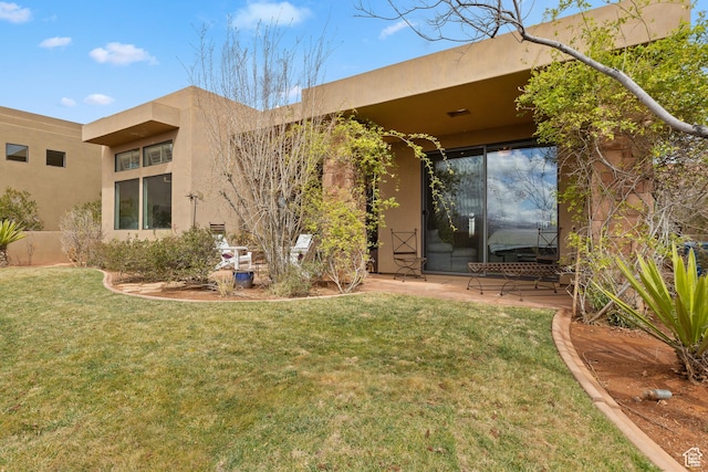 2139 W Cougar Rock Cir S Unit 135, St George, UT 84770 - back of property with a lawn, stucco siding, and a patio