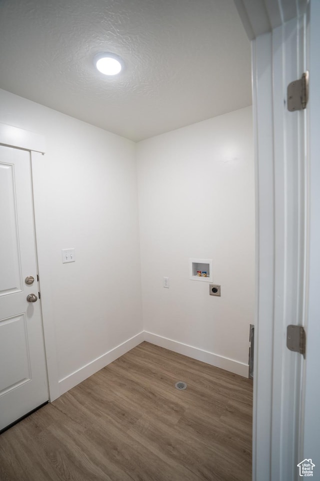 2277 E 3530 N Unit 511, Eagle Mountain, UT 84005 - laundry room with washer hookup, laundry area, wood finished floors, and electric dryer hookup