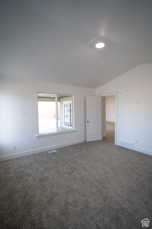 2277 E 3530 N Unit 511, Eagle Mountain, UT 84005 - carpeted spare room featuring vaulted ceiling, visible vents, and baseboards