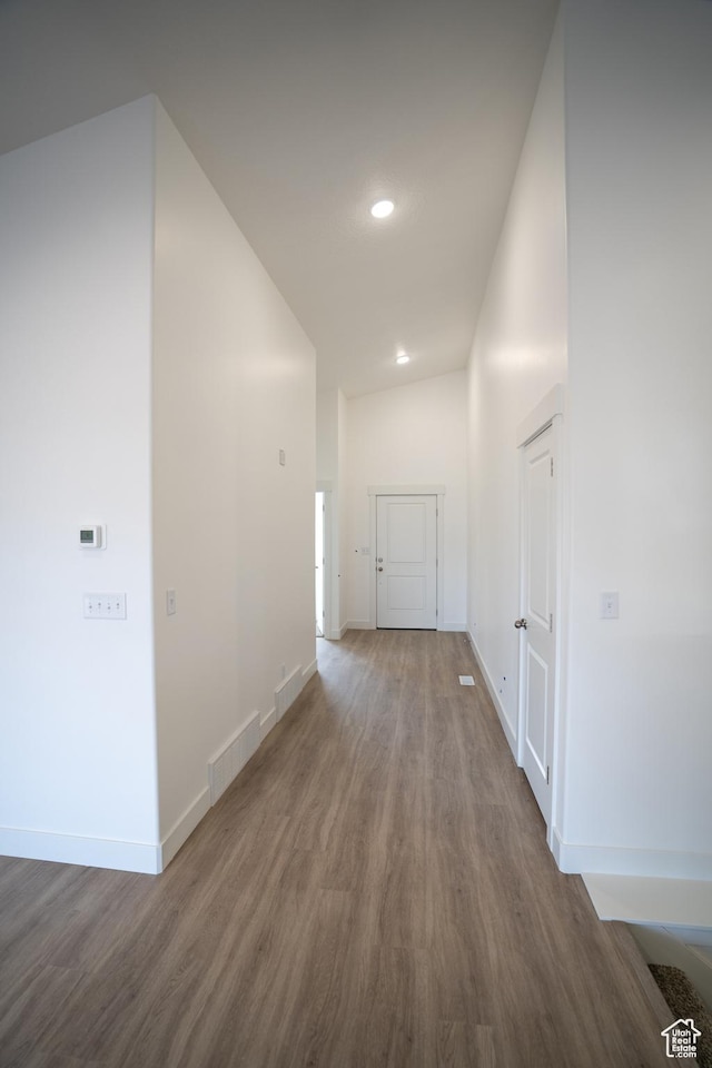 2277 E 3530 N Unit 511, Eagle Mountain, UT 84005 - hallway featuring recessed lighting, visible vents, baseboards, and wood finished floors