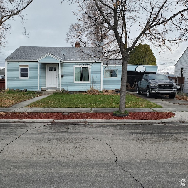 1744 W 150 N, Provo, UT 84601 - view of front of home with a front lawn, a chimney, driveway, and a shingled roof