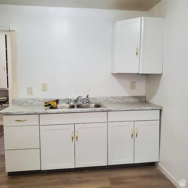 1744 W 150 N, Provo, UT 84601 - kitchen with baseboards, light countertops, wood finished floors, white cabinetry, and a sink