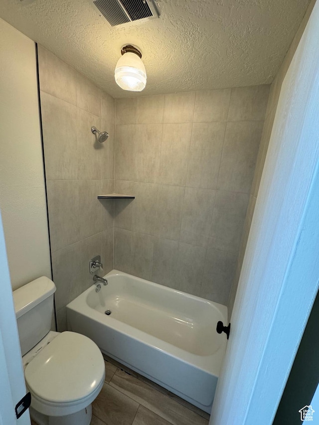 5630 S Meadow Ln Unit 197, South Ogden, UT 84403 - full bathroom featuring toilet, a textured ceiling, and visible vents