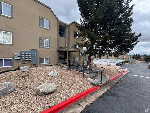 5630 S Meadow Ln Unit 197, South Ogden, UT 84403 - view of building exterior featuring fence